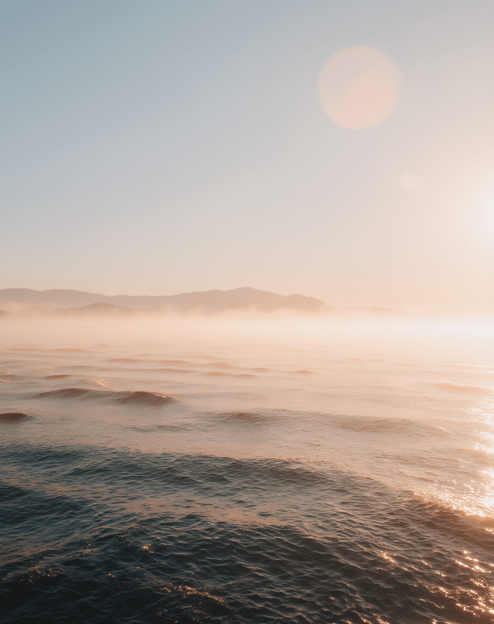 Rise & Shine – Dawn Landscape Poster Collection 3 Serene seascape with mist above the water at dawn.